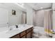 Bathroom with double vanity and bathtub at 671 Bloom Ter, Davenport, FL 33837