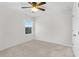 Bright bedroom with carpeted floor, ceiling fan, and window at 671 Bloom Ter, Davenport, FL 33837