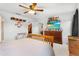 Bedroom with wood dresser and ceiling fan at 671 Bloom Ter, Davenport, FL 33837