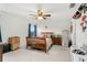 Bedroom with wood bed frame and ceiling fan at 671 Bloom Ter, Davenport, FL 33837