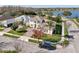 Aerial view of a two-story house near a lake, showcasing its location and neighborhood at 7202 Chelsea Harbour Dr, Orlando, FL 32829