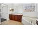 Bathroom with a corner soaking tub, double vanity, and a separate shower at 7202 Chelsea Harbour Dr, Orlando, FL 32829