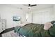 Green bedroom with dark hardwood floors and ceiling fan at 7202 Chelsea Harbour Dr, Orlando, FL 32829