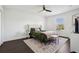 Bedroom with green bedding and floral patterned rug at 7202 Chelsea Harbour Dr, Orlando, FL 32829