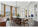 Modern dining room with a large black table, mid-century chairs, and stylish decor at 7202 Chelsea Harbour Dr, Orlando, FL 32829