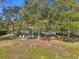 Spacious backyard with lawn and lounge chairs at 754 E Wildmere Ave, Longwood, FL 32750