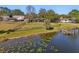 Lakefront backyard with a private dock and spacious grassy area at 754 E Wildmere Ave, Longwood, FL 32750