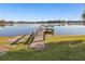 Wooden dock extending over calm lake water at 754 E Wildmere Ave, Longwood, FL 32750