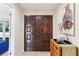 Interior entryway with dark wood double doors at 754 E Wildmere Ave, Longwood, FL 32750