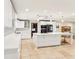 Modern white kitchen with island and stainless steel appliances at 754 E Wildmere Ave, Longwood, FL 32750