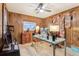 Home office with wood paneled walls and ample built-in shelving at 754 E Wildmere Ave, Longwood, FL 32750