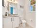 Small bathroom with toilet and single vanity at 7697 Fairfax Dr, Kissimmee, FL 34747