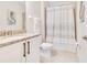 Bathroom with shower/tub combo and granite countertop at 7697 Fairfax Dr, Kissimmee, FL 34747