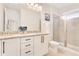 Elegant bathroom with double vanity, granite countertop, and shower at 7697 Fairfax Dr, Kissimmee, FL 34747