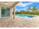 Relaxing pool area with patio and lush landscaping at 7697 Fairfax Dr, Kissimmee, FL 34747