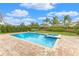 Inviting pool and spa with brick patio at 7697 Fairfax Dr, Kissimmee, FL 34747