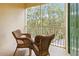 Private screened balcony overlooking lush trees at 8836 Dunes Ct # 307, Kissimmee, FL 34747