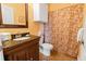 Bathroom with dark wood vanity and shower at 8836 Dunes Ct # 307, Kissimmee, FL 34747