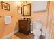 Clean bathroom with dark wood vanity and shower at 8836 Dunes Ct # 307, Kissimmee, FL 34747