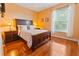 Bedroom with a queen-size bed and wood floors at 8836 Dunes Ct # 307, Kissimmee, FL 34747