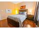 Bedroom with full-size bed and wood floors at 8836 Dunes Ct # 307, Kissimmee, FL 34747