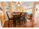 Bright dining room with hardwood floors and seating for six at 8836 Dunes Ct # 307, Kissimmee, FL 34747