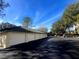 Row of white garages with parking spaces available at 8836 Dunes Ct # 307, Kissimmee, FL 34747