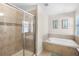 Bathroom with shower and soaking tub at 8882 Candy Palm Rd, Kissimmee, FL 34747