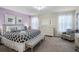 Elegant main bedroom with a king-size bed and a sitting area at 8882 Candy Palm Rd, Kissimmee, FL 34747