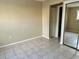 Bedroom with tile floors and mirrored closet doors at 950 Lake Destiny Rd # E, Altamonte Springs, FL 32714