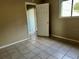 Bedroom with tile floors and door to outside at 950 Lake Destiny Rd # E, Altamonte Springs, FL 32714