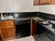 Kitchen corner with black appliances and granite countertops at 950 Lake Destiny Rd # E, Altamonte Springs, FL 32714