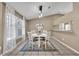 Charming dining area with a white table, four chairs, and a light fixture at 1004 Chance Cv, Oviedo, FL 32765