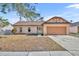 Inviting single-story home with attached garage and well-maintained lawn at 1004 Chance Cv, Oviedo, FL 32765