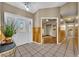 Clean hallway with wood-paneled walls and view into bathroom at 1004 Chance Cv, Oviedo, FL 32765