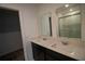 Modern bathroom with double vanity and shower at 1053 Waterfall Blvd, Davenport, FL 33837