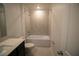 Clean bathroom with a bathtub, toilet and vanity at 1053 Waterfall Blvd, Davenport, FL 33837