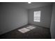 Bright bedroom featuring neutral walls and carpet at 1053 Waterfall Blvd, Davenport, FL 33837