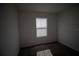 Simple bedroom with window and carpet flooring at 1053 Waterfall Blvd, Davenport, FL 33837