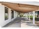 Long covered patio perfect for outdoor dining at 122 Magnolia Dr, Winter Haven, FL 33881