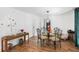 Bright dining room with glass-top table and four chairs at 122 Magnolia Dr, Winter Haven, FL 33881