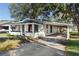 Charming one-story home with a carport and landscaped yard at 122 Magnolia Dr, Winter Haven, FL 33881