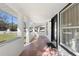 Front porch with white columns and view of street at 122 Magnolia Dr, Winter Haven, FL 33881