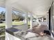 Front porch with white columns and a view of the street at 122 Magnolia Dr, Winter Haven, FL 33881