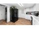 Modern kitchen with white cabinets and black appliances at 122 Magnolia Dr, Winter Haven, FL 33881