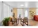 Living room with hardwood floors, comfortable seating, and potted plants at 122 Magnolia Dr, Winter Haven, FL 33881