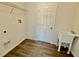 Laundry room with utility sink, shelving, and vinyl flooring at 1304 Hillsborough Ct, Kissimmee, FL 34759