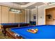 Game room featuring two billiard tables and a relaxing seating area at 1351 Venezia Ct # 304, Davenport, FL 33896