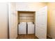 Laundry closet with washer and dryer, and shelving at 1351 Venezia Ct # 304, Davenport, FL 33896