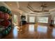 Yoga studio with hardwood floors, large mirrors, and exercise balls at 1351 Venezia Ct # 304, Davenport, FL 33896